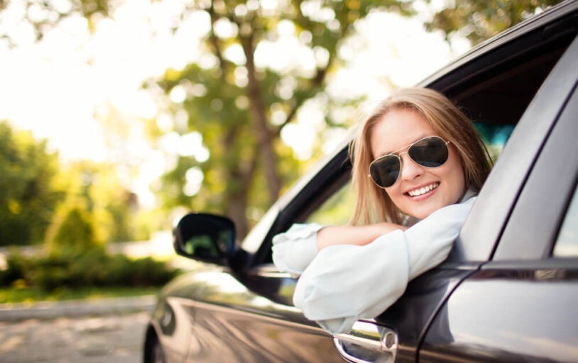 Young woman in car