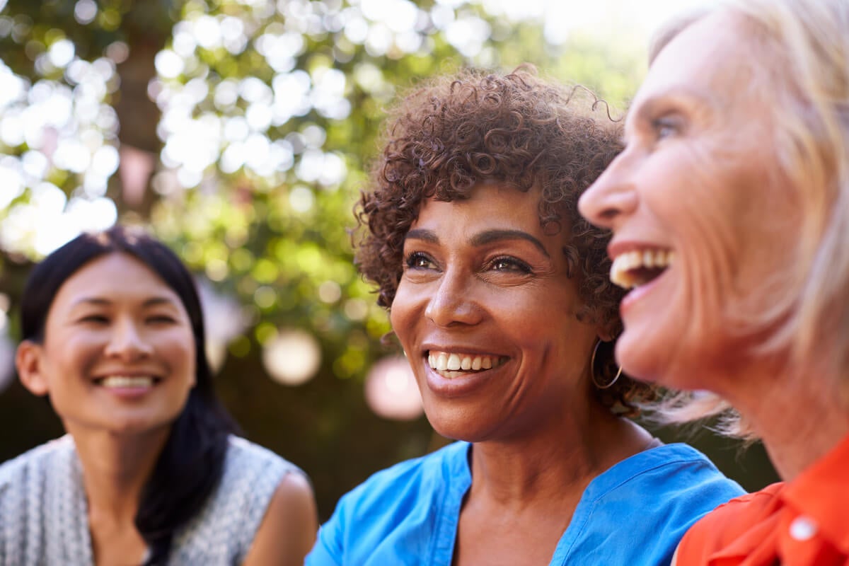 Three women laughing