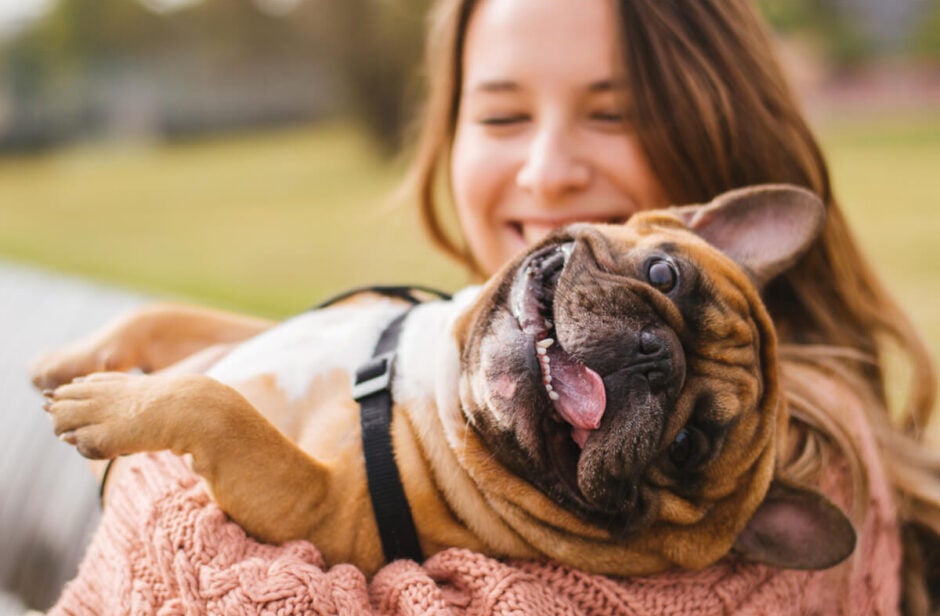 Woman holding her dog