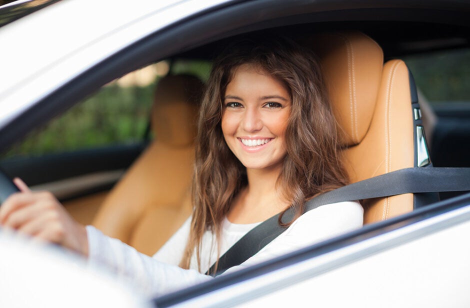 Woman sitting in the front seat of a car