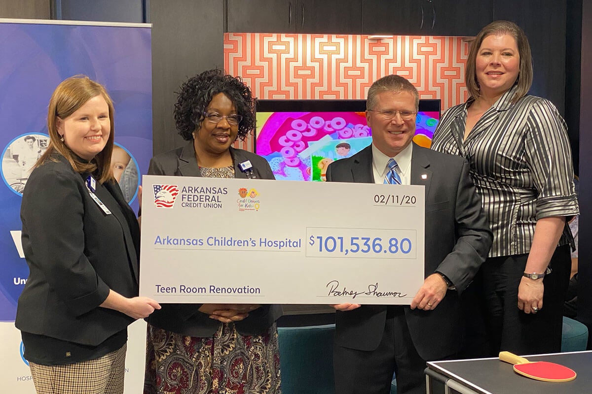 Arkansas Federal Credit Union presenting Arkansas Childrens with a check for teen room
