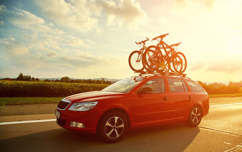 Car driving on road with bike rack