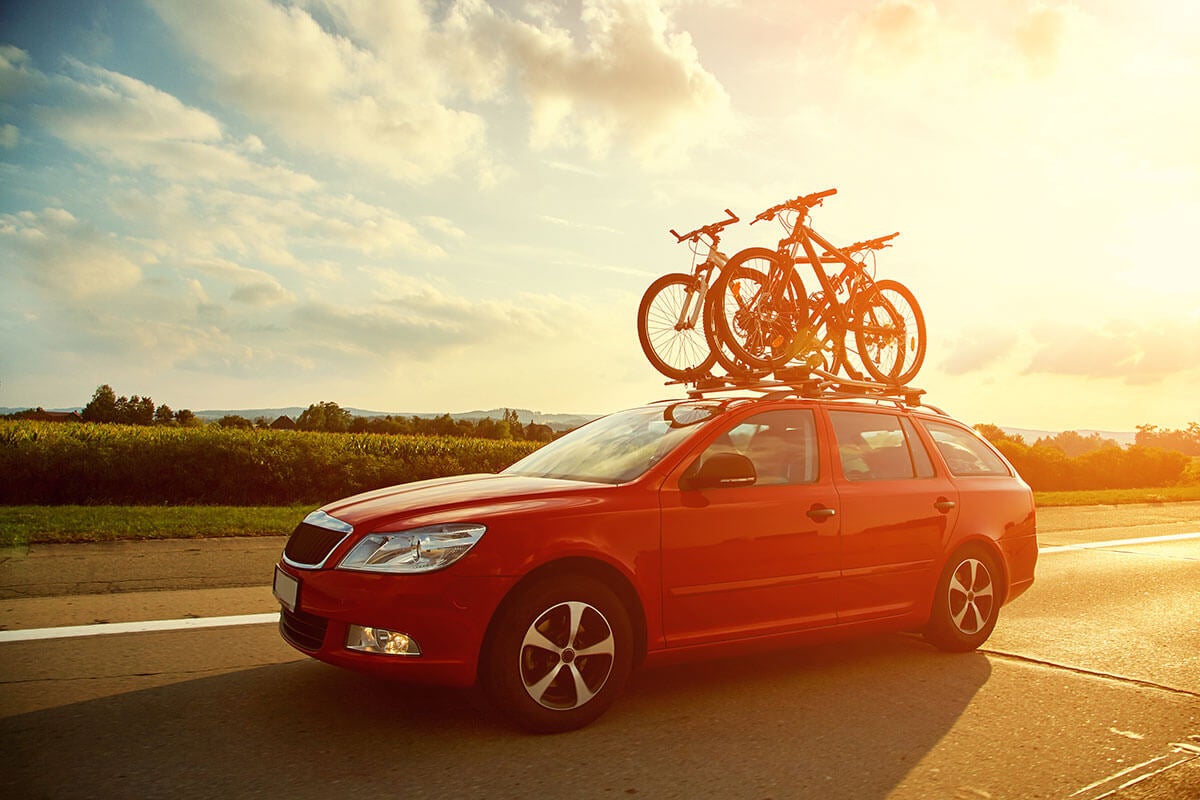 Car driving on road with bike rack