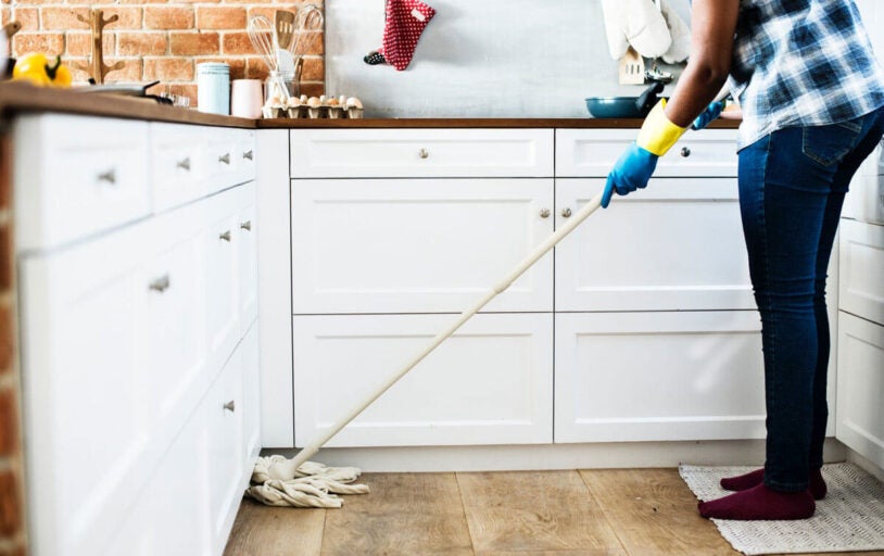 Woman mopping the kitchen floor