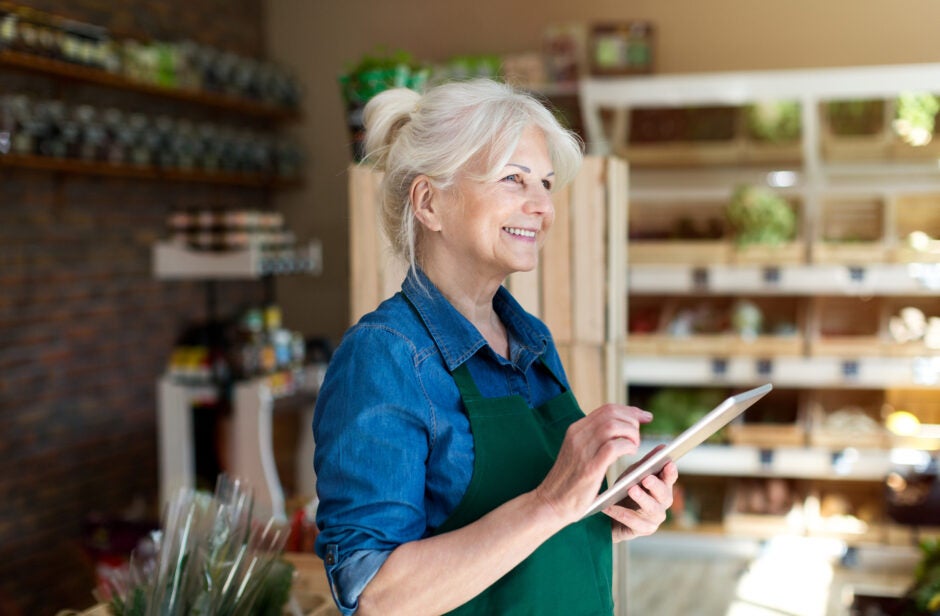 Happy business owner in their store