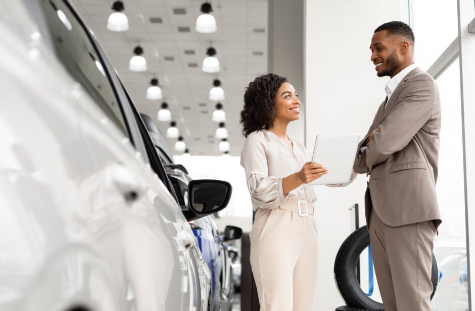 Woman at car dealership