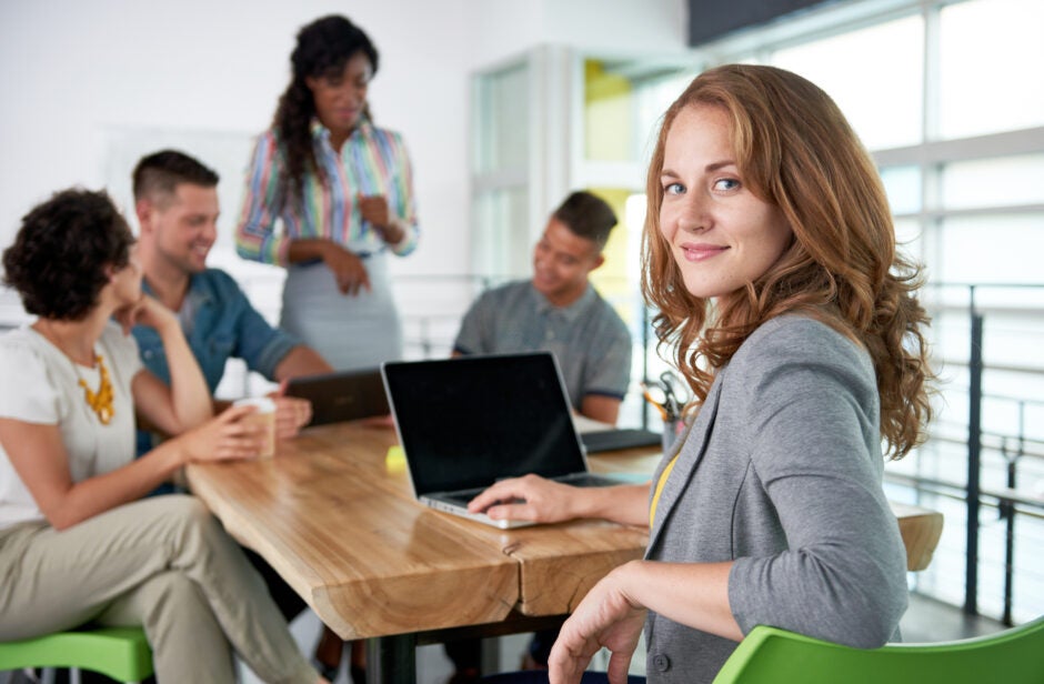 Woman smiling at conference table