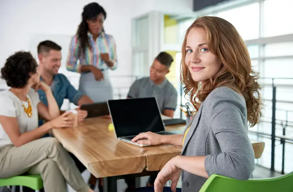 Woman smiling at conference table