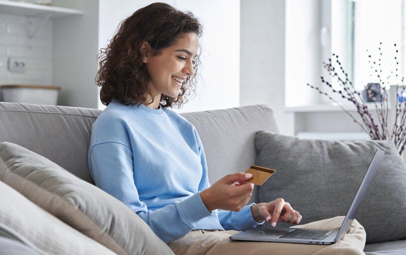 Young woman making a purchase online with an AFCU credit card