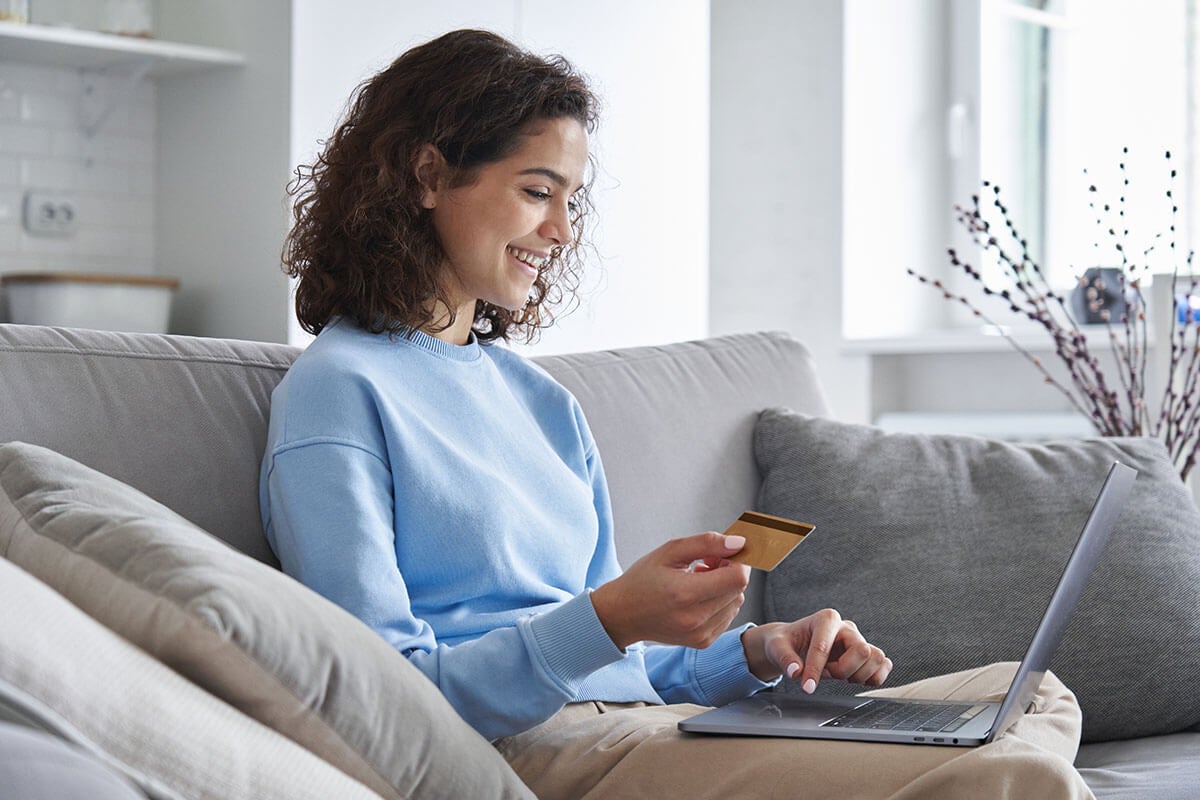 Young woman making a purchase online with an AFCU credit card